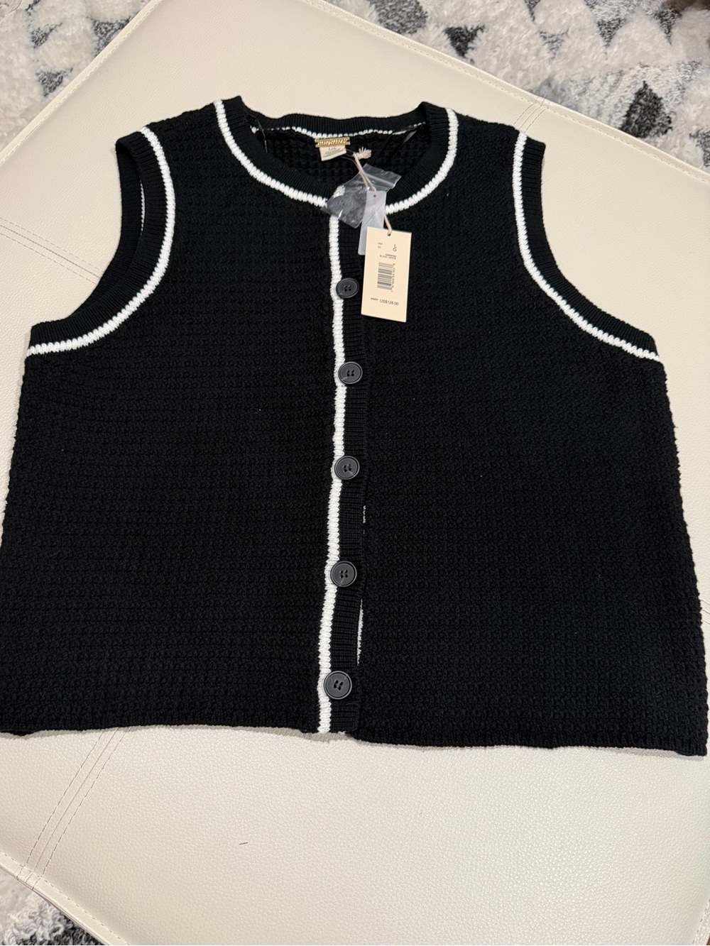 Women's sleeveless button up sweater vest